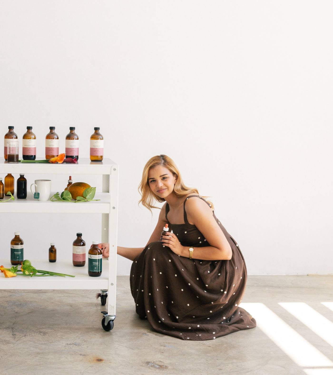 Danna beside her herbal dispensary trolley